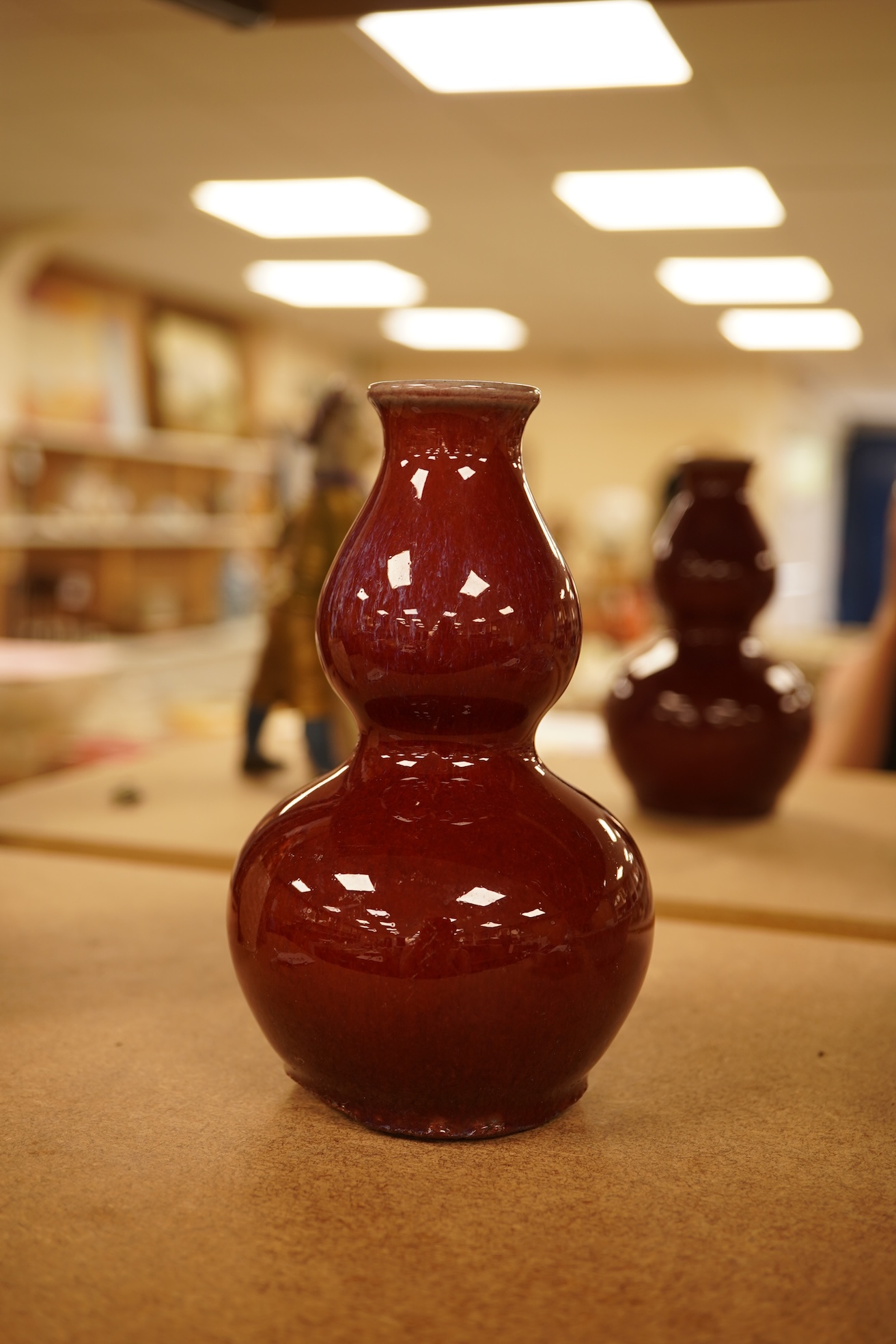 A Chinese Sang De Boeuf glazed double gourd vase, 14.5cm high